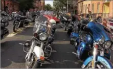  ?? L.A. PARKER — THE TRENTONIAN ?? Hundreds of motorcycle­s parked on Perry St. Saturday morning as family and friends attended the funeral for city resident Jabbar Manning, a member of Trenton’s famous Cycle Kings Motorcycle Club.