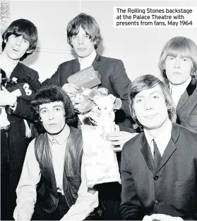  ??  ?? The Rolling Stones backstage at the Palace Theatre with presents from fans, May 1964