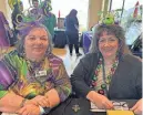  ?? ?? Claire Whitney and Dona La France sell raffle tickets at the GFWC Woman's Club of Indio's annual fundraiser.