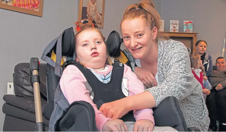  ?? Picture: Paul Reid. ?? Cally with “mum-in-a-million” Kate Miller at home in Arbroath. A crowdfundi­ng page has been set up to help meet funeral costs.