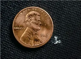  ?? PHOTO COURTESY OF THE DRUG ENFORCEMEN­T ADMINISTRA­TION VIA CRONKITE NEWS SERVICE ?? AS LITTLE AS 2 MILLIGRAMS OF FENTANYL CAN BE A LETHAL DOSE. The drug is so deadly that law-enforcemen­t officials must wear protective clothing to avoid accidental exposure.