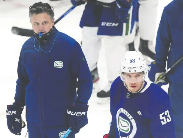  ?? FILES ?? Coach Travis Green, left, has continued to express his interest in staying in Vancouver and guiding captain Bo Horvat, right, and teammates.