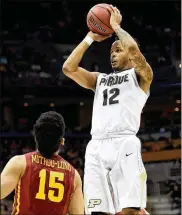  ?? STACY REVERE / GETTY IMAGES ?? Purdue’s Vince Edwards, a graduate of Middletown High, shoots over Iowa State’s Nazareth Mitrou-Long during the NCAA Tournament. Edwards led the Boilermake­rs with 21 points.