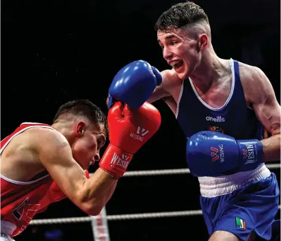  ??  ?? Dean Clancy of Sean McDermott, Co Leitrim, right, in action against Patryk Adamus of Drimnagh, Co Dublin, in their 57kg bout during the IABA Irish National Elite Boxing Championsh­ips Finals at the National Stadium in Dublin on Friday night.
Pic: Piaras Ó Mídheach/Sportsfile.