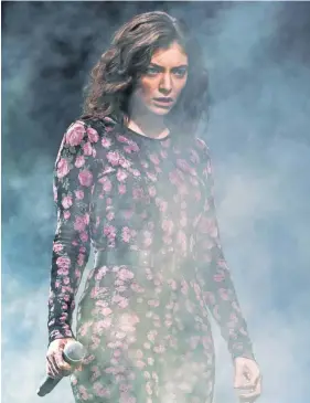  ?? IAN GAVAN, GETTY IMAGES ?? Lorde, performing at the Glastonbur­y Festival in June, says she’s “basically a witch” in describing her style.