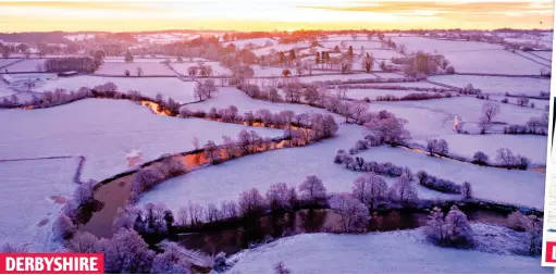  ?? ?? DERBYSHIRE
Golden touch: The sun lights up the Dove river at dawn yesterday as it winds through the snow-covered landscape