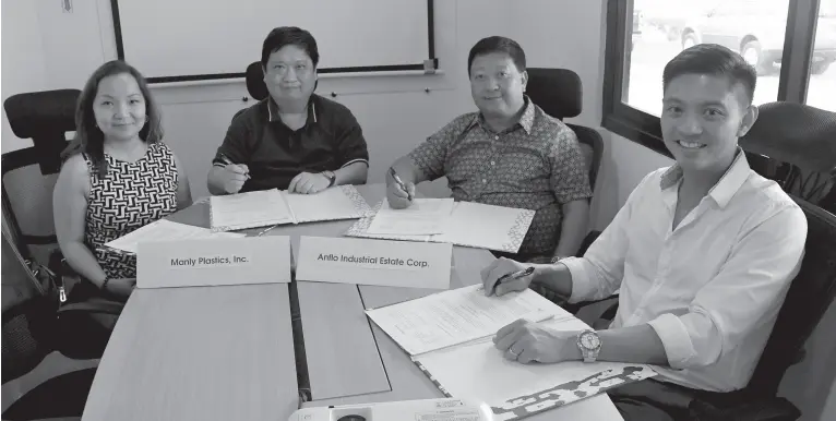  ?? PR ?? AGREEMENT between Manly Plastics Inc. and the Anflo Industrial Estate are signed with Manly being represente­d by (from left) Valerie Co, vice for finance, Vic Co, vice president/ treasurer, and Virgilio Co, president. At right is Ricardo F. Lagdameo, AIE first vice president.