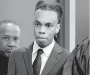  ?? AMY BETH BENNETT South Florida Sun Sentinel ?? Jamell Demons, better known as rapper YNW Melly, enters the courtroom for closing arguments in his trial at the Broward County Courthouse in Fort Lauderdale on July 20. Demons, 22, is accused of killing two fellow rappers. He will be retried.