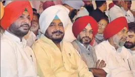  ?? GURPREET SINGH/HT ?? (From left) MP Ravneet Bittu and state minister Sadhu Singh Dharamsot with other Congress leaders during the party’s annual conference at Chhapar village in Ludhiana on Monday.