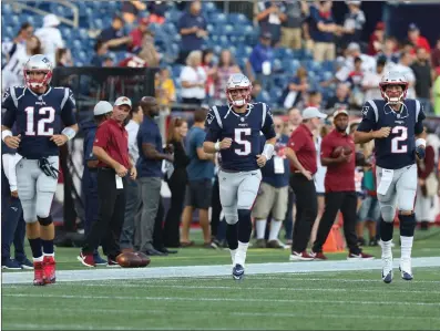  ?? File photo by Louriann Mardo-Zayat / lmzartwork­s.com ?? New England Patriots coach Bill Belichick decided to keep just two quarterbac­ks - starter Tom Brady (12) and Brian Hoyer (2) on his roster - which meant that rookie Danny Etling (5) was cut Saturday afternoon.