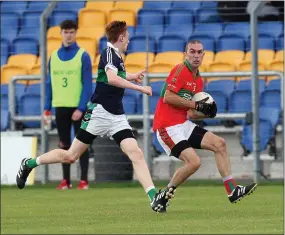  ??  ?? Rathnew’s Enan Glynn looks to cut inside on Darragh Rochford of Bray Emmets during the SFC clash in Joule Park Aughrim.