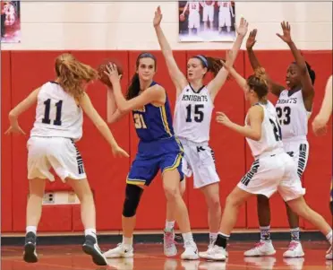  ?? PETE BANNAN — DIGITAL FIRST MEDIA ?? Downingtow­n East’s Bella Smuda (31) is bottled up by Rustin’s Grace Palona (11), Erin Gallagher (15), Becca Magrone (21) and Dakiya Daniels (23) late in the fourth quarter Saturday night.