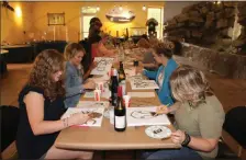  ?? Severo Avila ?? Several Rome residents attended a Sip N Paint fundraiser at the ECO Center Thursday evening where local artist Siri Selle led them in painting a colorful cow.
