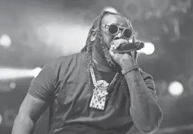  ?? COLIN BOYLE/MILWAUKEE JOURNAL SENTINEL ?? Rapper T-Pain makes an appearance with The Lonely Island as they perform at the Miller Lite Oasis on June 28, 2019.