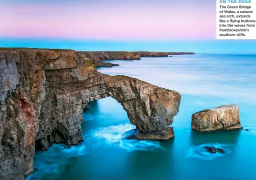  ?? ?? ON THE EDGE
The Green Bridge of Wales, a natural sea arch, extends like a flying buttress into the waves from Pembrokesh­ire’s southern cliffs.