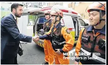  ??  ?? MEET & GREET With firefighte­rs in Seoul