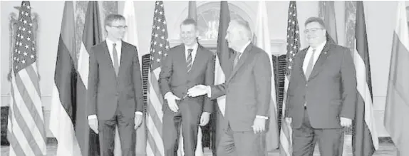  ?? AGENCE FRANCE PRESSE ?? US Secretary of State Rex Tillerson (2nd right), welcomes the foreign ministers of Estonia, Latvia, and Lithuania to the State Department.