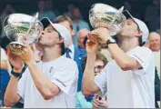  ?? Andy Rain European Pressphoto Agency ?? MIKE AND BOB BRYAN savor Wimbledon win that made them holders of all the major doubles titles.