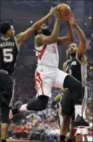  ?? ERIC CHRISTIAN SMITH — THE ASSOCIATED PRESS ?? Houston’s James Harden (13) drives past San Antonio’s Dejounte Murray (5) and Kawhi Leonard (2) during the first half Game 3 Friday in Houston. in