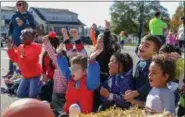  ??  ?? Treena Ferguson’s kindergart­en class joins in a game during the recent fall fest at Rupert Elementary School in Pottstown.