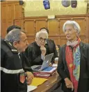  ??  ?? PARIS: Internatio­nal Monetary Fund chief Christine Lagarde confers with her lawyers, Patrick Maisonneuv­e (left) and Bernard Grelon (2nd left) prior to her trial at the special Paris court, France yesterday. — AP