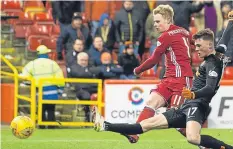  ??  ?? Former Tangerines favourite Gary Mackay-Steven fires home Aberdeen’s fourth – and his second – of the game.