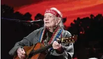  ?? TNS ?? Willie Nelson, about to turn 91, performs during the Farm Aid festival at Ruoff Music Center in Noblesvill­e, Indiana, last December. He is on the road again after performing 68 concerts last year.