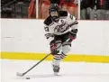  ?? Dave Stewart/Dave Stewart ?? New Canaan's Doster Crowell lines up a shot against Fairfield Prep during a boys ice hockey game at the Darien Ice House on Dec. 16.