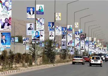  ??  ?? Election posters of parliament­arian candidates are installed during the first day of elections campaign in Kabul. — Reuters photo