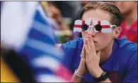  ?? (AP/Matt Dunham) ?? An England fan watches the Euro 2020 round on Thursday at fan zone in central Trafalgar Square in London.