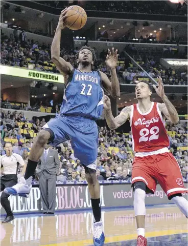  ?? BRANDON DILL / THE ASSOCIATED PRESS ?? Minnesota forward Andrew Wiggins, left, insists that when the game begins, playing at Toronto’s Air Canada Centre isn’t much different than any other venue in the NBA.