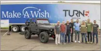  ?? PHOTO COURTESY OF TURN5 ?? Turn5 presented 18-year-old Jeep enthusiast Earl Offenback with a made over 2002 Jeep Wrangler Sport as part of his Make-A-Wish request. Turn5 donated the parts and time for the makeover. Shown here left to right are: Dennis Heron, MakeA-Wish president...