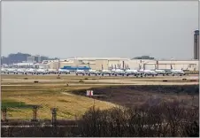  ?? ANDREW RUSH — PITTSBURGH POST-GAZETTE VIA AP ?? Dozens of parked American Airlines planes are parked at the Pittsburgh Internatio­nal Airport last Friday in Moon, Pa. The airport has become a parking destinatio­n for the airline during the COVID-19 shutdown.