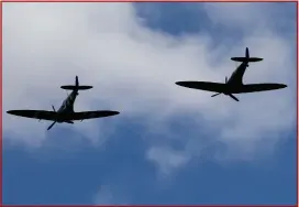  ??  ?? A rare honour as the Spitfires fly over the village before the funeral