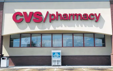  ?? AP FILE PHOTOS ?? CALLED TO TASK: Florida Attorney General Pam Bondi added CVS and Walgreens to a lawsuit, alleging the two chains failed to limit suspicious drug sales.