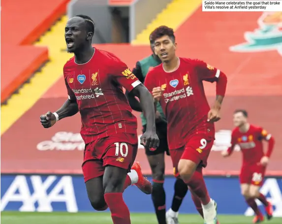  ??  ?? Saido Mane celebrates the goal that broke Villa’s resolve at Anfield yesterday