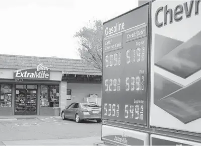  ?? RICH PEDRONCELL­I/AP ?? Chevron Gas prices over the $5 mark are displayed Tuesday in Visalia, California.