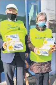  ?? Marian Roche) (Pic: ?? Locals Michael White and Kitty Pyne outside Mitchelsto­wn Credit Union last Friday for the Irish Cancer Society’s Daffodil Day fundraiser.