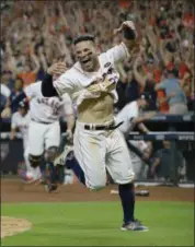  ?? ASSOCIATED PRESS FILE ?? The Astros’ Jose Altuve reacts after scoring the gamewinnin­g run during the ninth inning of Game 2 in the ALCS against the Yankees in Houston on Oct. 14.