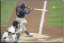  ?? GENE J. PUSKAR - THE ASSOCIATED PRESS ?? Milwaukee Brewers’ Lorenzo Cain drives in a run with a single off Pittsburgh Pirates relief pitcher Nik Turley during the seventh inning of a baseball game in Pittsburgh, Monday, July 27, 2020.