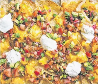  ?? MELINA HAMMER ?? Breakfast nachos, from the cookbook Simply Julia, are a fun take on a popular food.