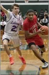  ?? JENNIFER FORBUS — FOR THE MORNING JOURNAL ?? Elyria’s Daylan Sharlow races Lakewood’s Riley Ulintz to the basket.