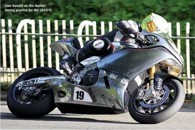  ??  ?? Cam Donald on the Norton during practice for the 2014 TT.