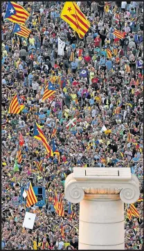  ??  ?? People gather as they wait for the start of the closing meeting of the Catalan pro-independen­ce groups and political parties, ahead of the October 1 referendum, in Barcelona yesterday.