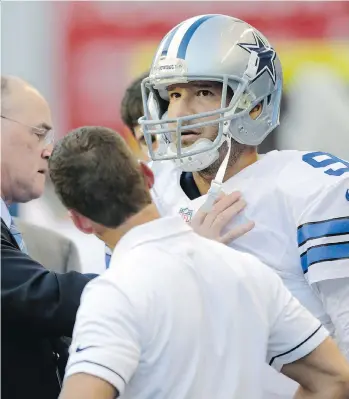  ?? STEPHEN BRASHEAR/ THE ASSOCIATED PRESS FILES ?? Dallas Cowboys’ quarterbac­k Tony Romo is examined on the sideline after he left the game with an injury on Thursday.