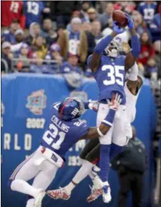  ?? JULIO CORTEZ —THE ASSOCIATED PRESS ?? Giants’ defensive back Curtis Riley intercepts a pass intended for Tampa Bay’s DeSean Jackson during New York’s 38-35 win over the Buccaneers Sunday.