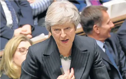  ?? Picture: AFP ?? UNDER FIRE: British Prime Minister Theresa May gives a statement to the House of Commons on the draft withdrawal agreement between the EU and the UK