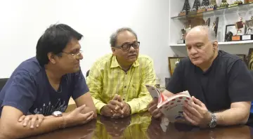  ??  ?? (From right) Rahul, Jayant and copywriter Manish Jhaveri interact during an interview with AFP in Mumbai.