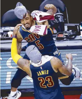  ?? AFP ?? LeBron James and J.R. Smith of the Cleveland Cavaliers celebrate their win over the Toronto Raptors in Game Six of the Eastern Conference Finals during the 2016 NBA Playoffs at Air Canada Centre in Toronto, Canada.