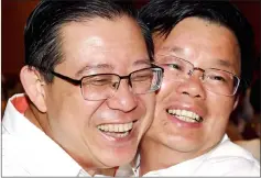  ??  ?? Lim (left) hugging Chow after winning the P043 Bagan parlimenta­ry (DUN) N23 Air Putih state seats while Chow won the P049 Tanjong parliament­ary and DUN N26 Padang Kota state seats during the May 9 elections. — Bernama photo